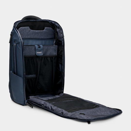 Nomatic Navy Backpack Open Pocket Front Angle View#color_navy